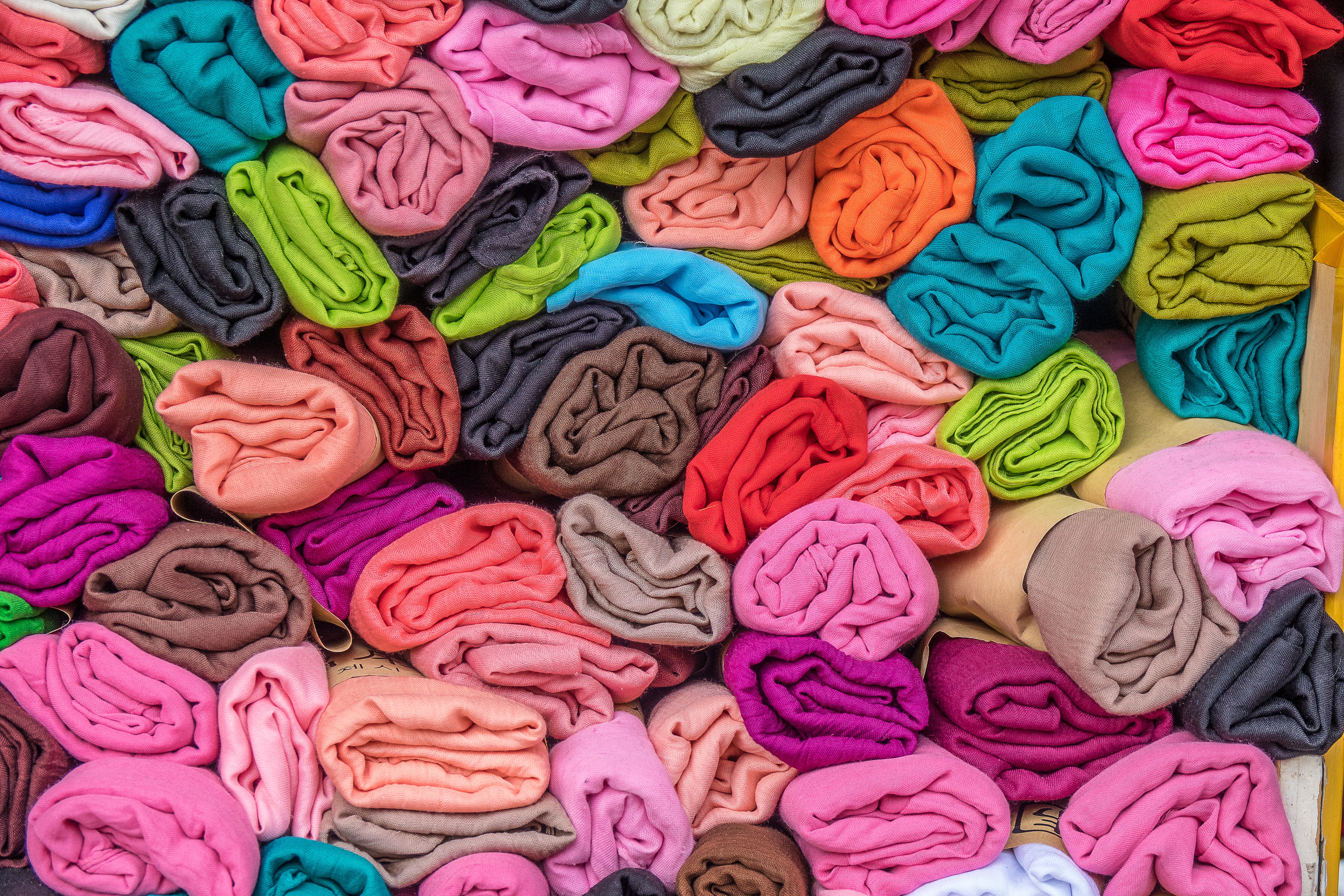 A pile of colorful fleece blankets